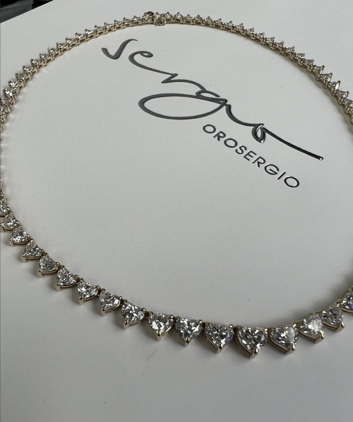Heart-shaped diamond rivière necklace by OROSERGIO Toronto