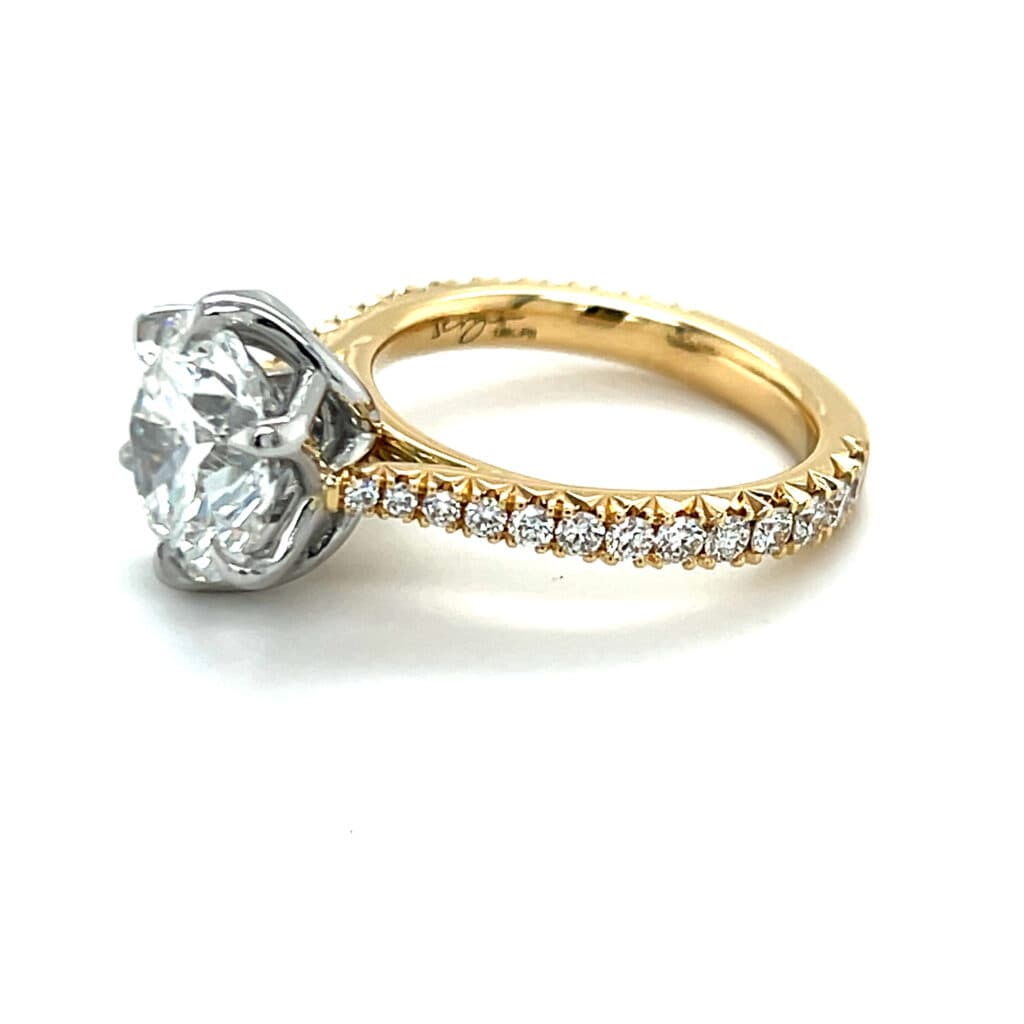 Custom diamond engagement ring by OROSERGIO — pavé gold band with round brilliant